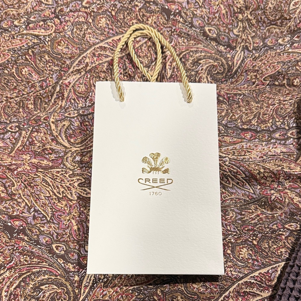 Creed White Bag with Gold Detailing